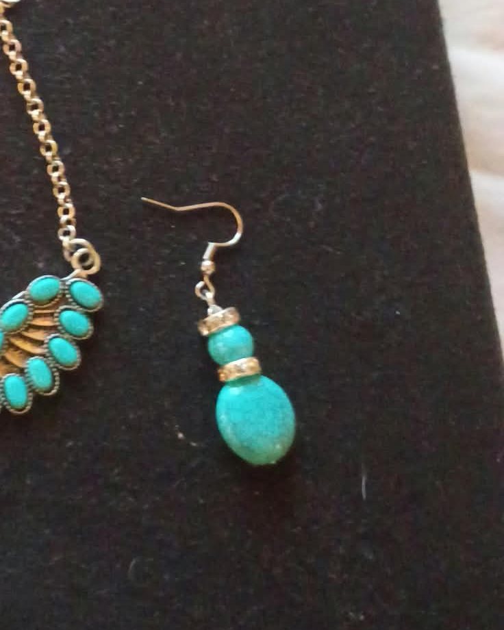 A natural turquoise drop earring from Ronald's eagle set