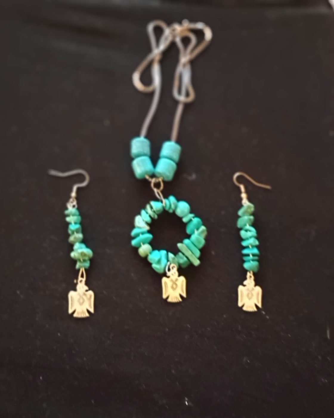 Natural turquoise necklace and earrings with Thunderbird charms